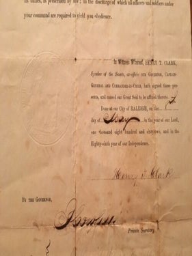 The State of North Carolina Commission for Zaccheus Ellis as second Lieutenant of Artillery as of 10 March 1862, signed by Henry T. Clark (North Carolina Civil War Governor).