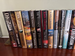 Collection of 23 SIGNED John Grisham Novels, All SIGNED First Edition Books