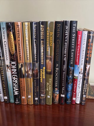 Collection of 23 SIGNED John Grisham Novels, All SIGNED First Edition Books