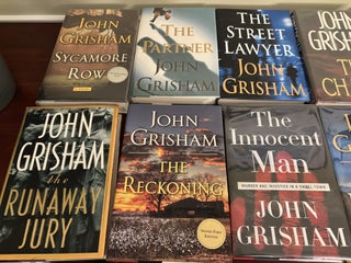 Collection of 12 SIGNED John Grisham Novels, All SIGNED First Edition Books.