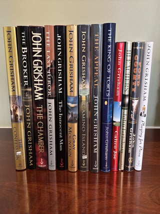 Collection of 13 SIGNED John Grisham Novels, All SIGNED First Edition Books